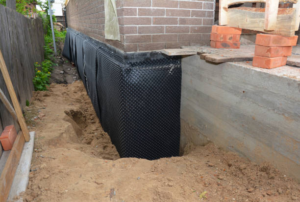 Happy homeowners after waterproofing job in Carle Place